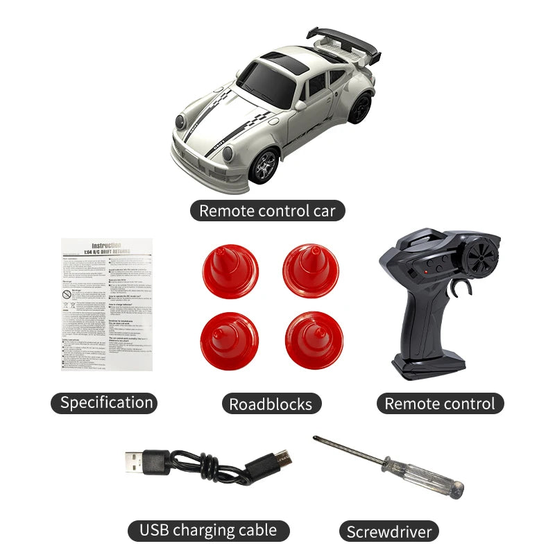 A white and black 1:64 scale RC drift car with remote control accessories including a screwdriver and USB charging cable.