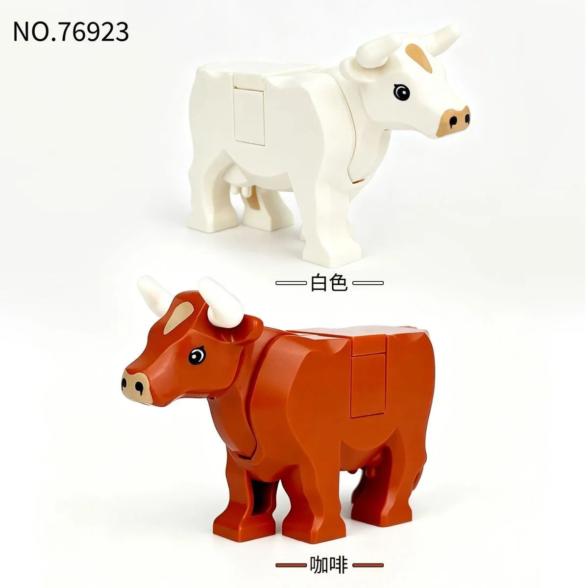 A set of two building block models, one white and one orange, depicting cattle or similar animals.