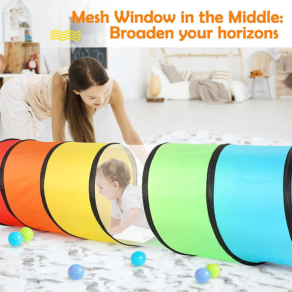 Colorful pop-up play tunnel with bright orange, yellow, green, and blue sections on a white floor.