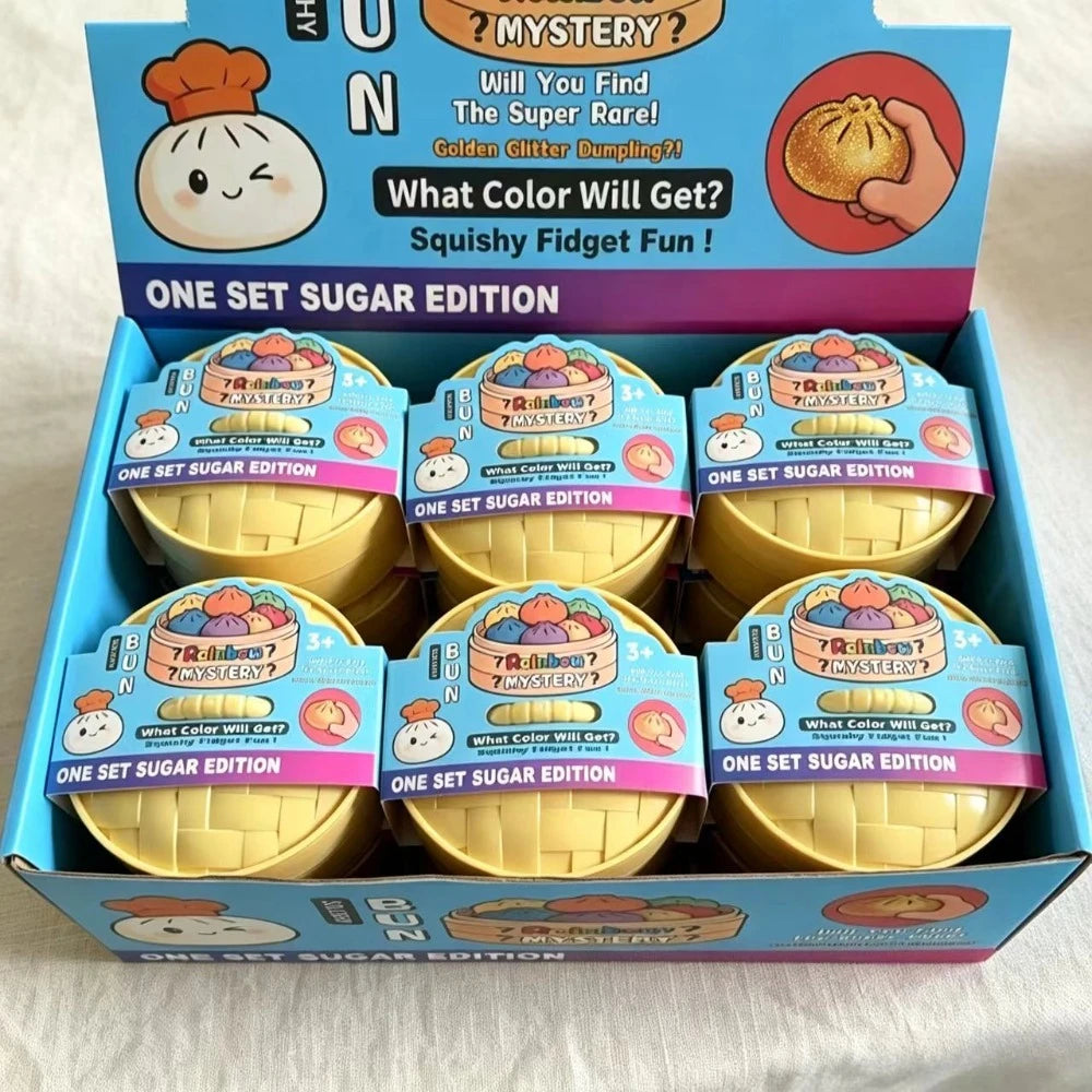 A box of squishy fidget fun toys featuring golden dumplings and mystery elements.