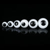 A row of glossy white plastic safety eyes for amigurumi and stuffed animals