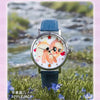 A blue strap watch featuring a My Little Pony Magic Sweetheart design on the face, set against a natural outdoor background.
