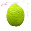 A bright lime green squishy stress ball with a textured surface.