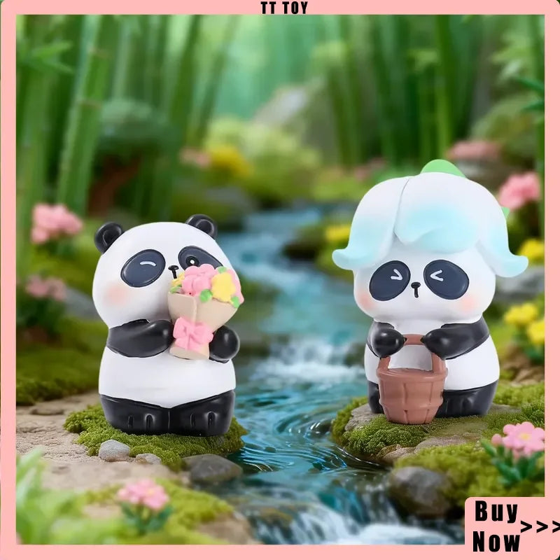 A white and black panda collectible figure with light blue accents sits near a small stream surrounded by green moss and plan