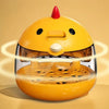 A yellow compact automatic egg incubator with a transparent window and heating element.