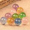 A collection of colorful glitter bouncy balls in various shades including pink, purple, yellow, green, and blue.