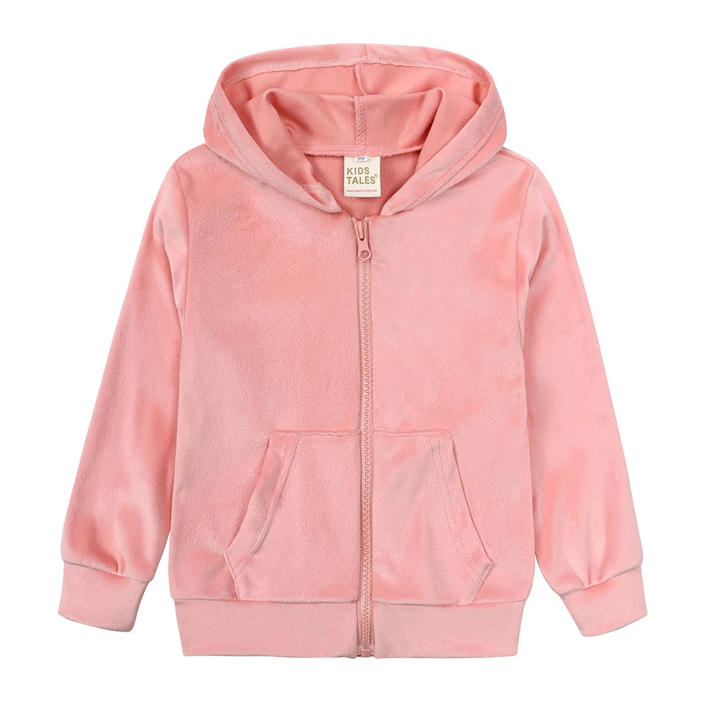 A pink velvet kids tracksuit set featuring a hooded zipper jacket and matching pants.