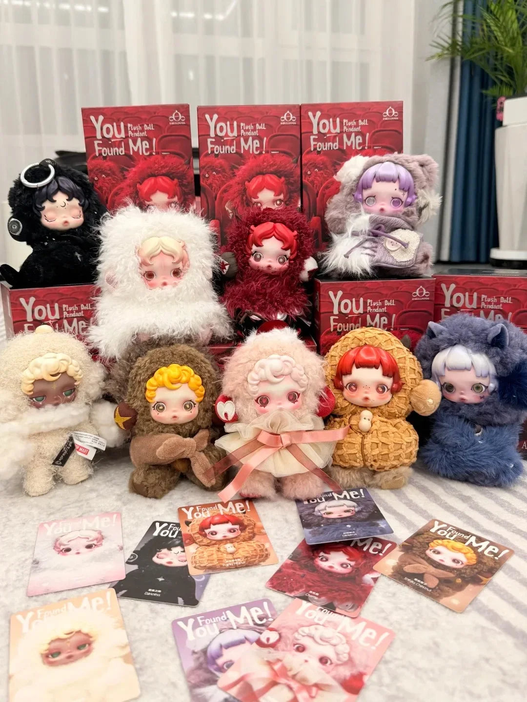 A collection of Skullpanda You Found Me! series collectible figures in various colors and poses.