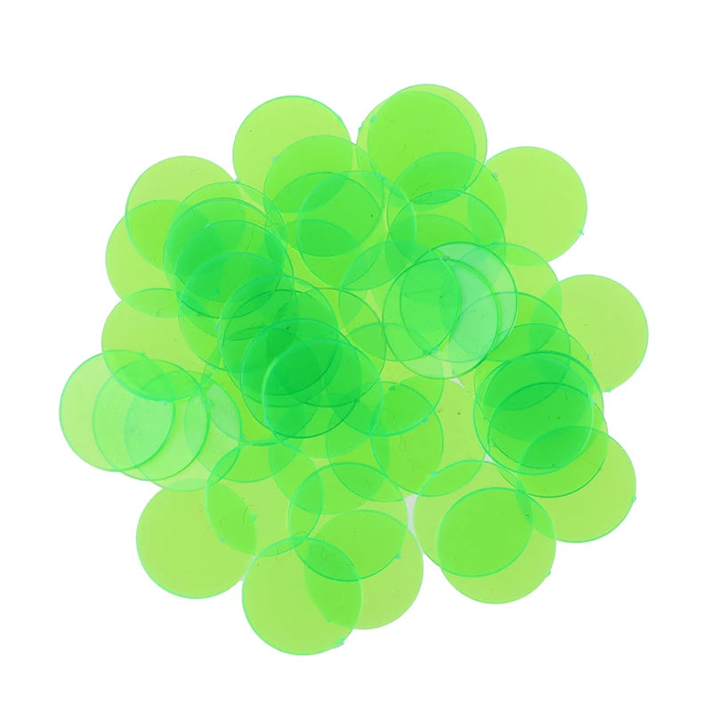 A pile of 50 translucent lime green plastic bingo chips for games and family fun