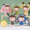 A collection of seven crocheted dolls in various colors and styles, including pink, green, yellow, and blue.
