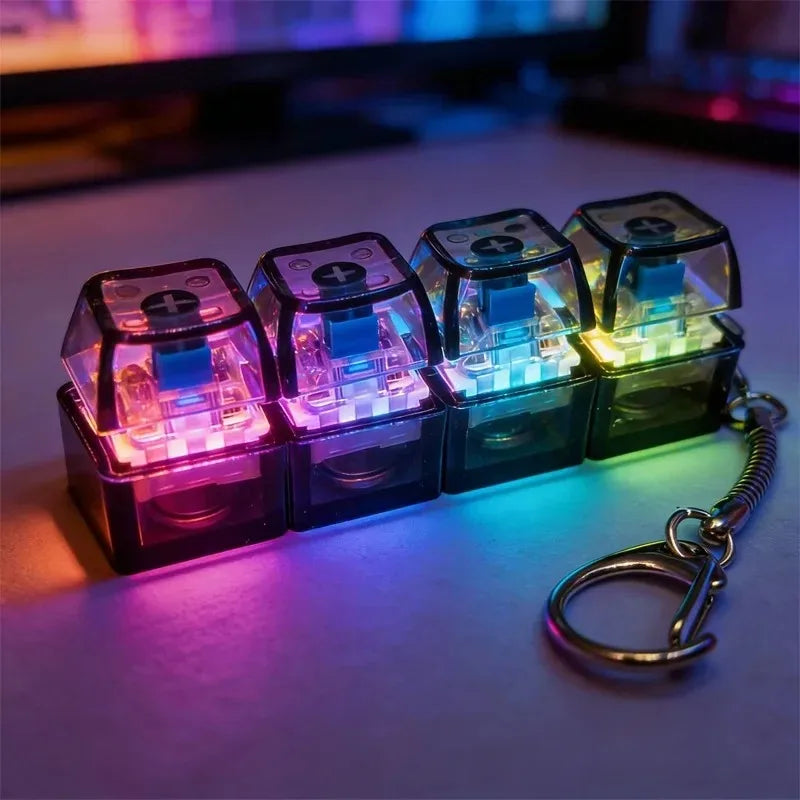 A set of six black keyboard fidget toys with blue LED lights are displayed on a surface.