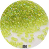 A pile of bright lime green round loose glass seed beads for jewelry making