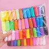 A collection of 36-color air dry modeling clay in various shades is displayed in a clear plastic bag.