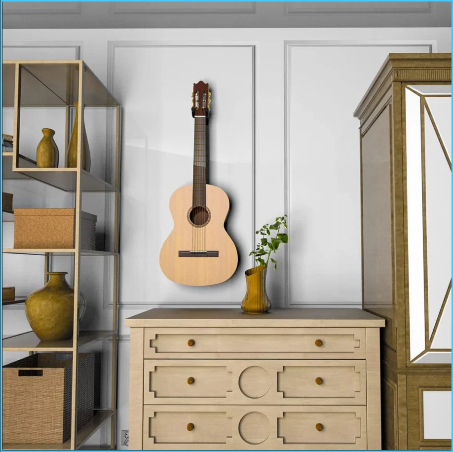 A solid wood guitar wall mount hanger displaying a acoustic guitar, ukulele, and violin on a light wood cabinet.