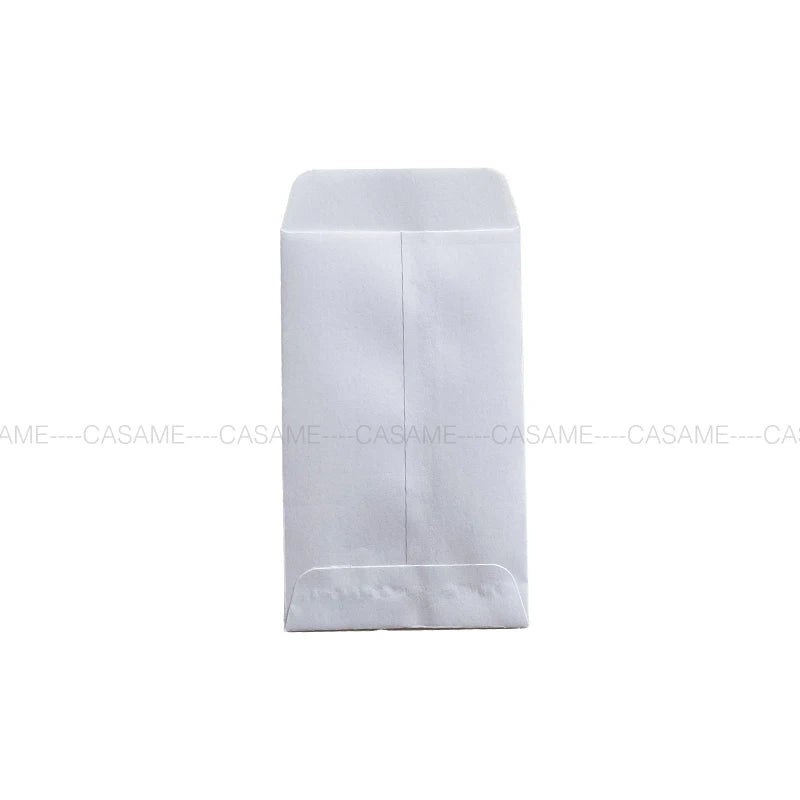 A white mini kraft paper gift bag for party favors or weddings.