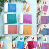 A collection of floral and leaf texture clay rollers in various colors, including pink, purple, orange, and teal, displayed o