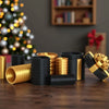 A collection of nested black and gold cylindrical boxes used for storing cash or gifts.
