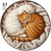 A jigsaw puzzle showing an orange tabby cat sleeping peacefully on a light-colored fabric.