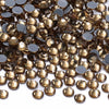 A close-up view of small, round glass crystal hot fix rhinestones in various shades of amber and gold.