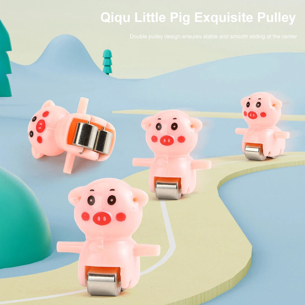 Pink pig pulley toy set with an electric track slide on a light blue background.