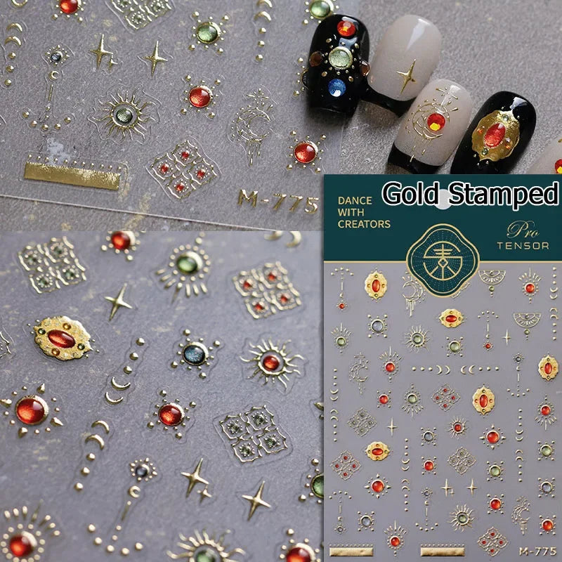 Gold stamped nail art stickers featuring various decorative elements and symbols for gothic style nails