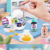 A hand is opening a miniature fridge playset revealing surprise mini food capsules and toys.