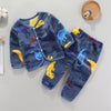 A navy blue fleece jacket and pants set for a baby featuring cartoon dinosaur prints.