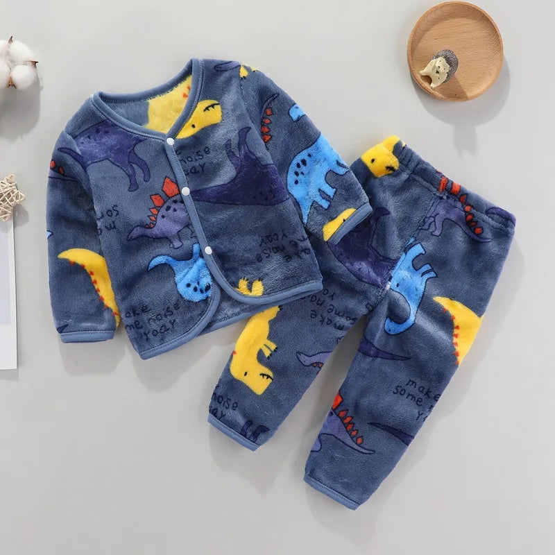 A navy blue fleece jacket and pants set for a baby featuring cartoon dinosaur prints.