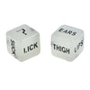 Two translucent dice showing words like SUCK, LICK, EARS, THIGH, and LIPS for a couples' love game