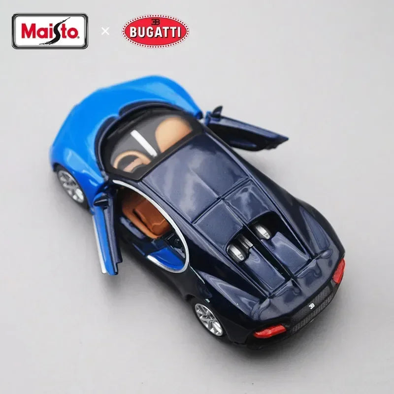 Blue diecast model of a sports car, inspired by the Porsche 911 GT2 RS, shown against a light gray background.