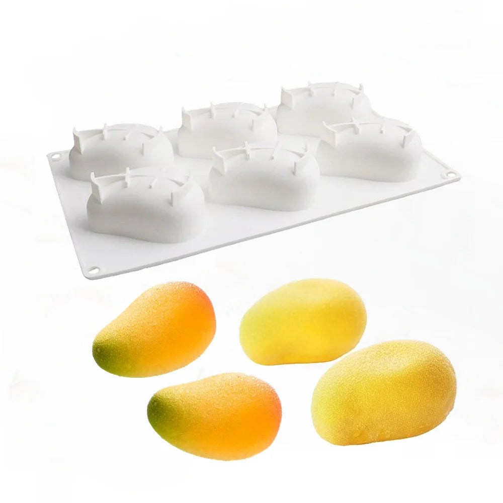 A white silicone mold tray with multiple fruit-shaped molds for baking and desserts.