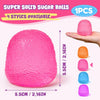 A pink super solid sugar ball squishy toy with four styles available shown on a hand.
