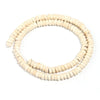 A strand of natural light beige or cream-colored wooden beads coiled into a circle.