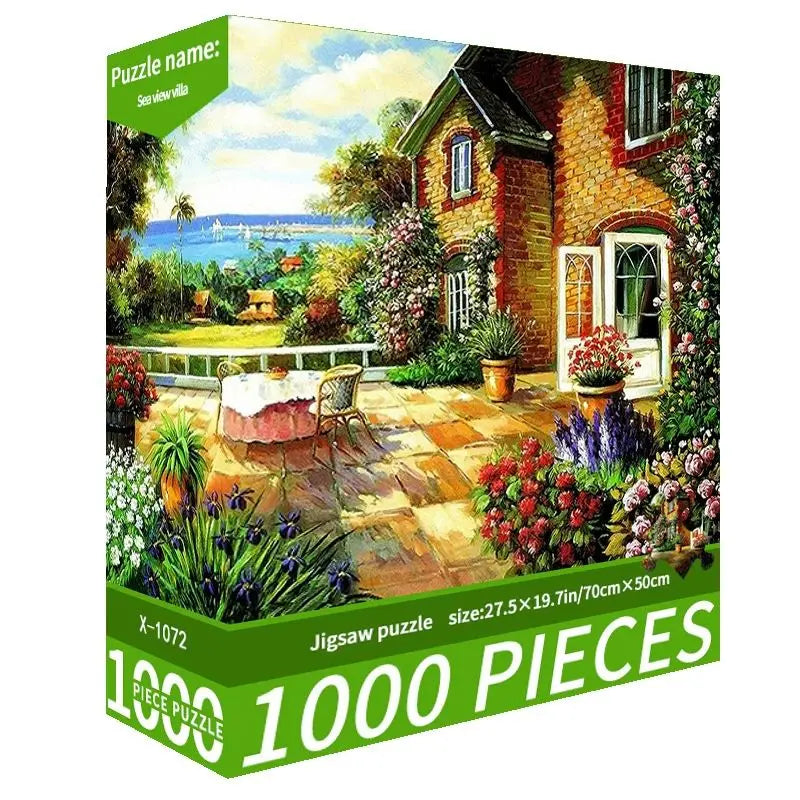 A box of a 1000-piece jigsaw puzzle depicting a pastoral scene with a stone house and greenery.