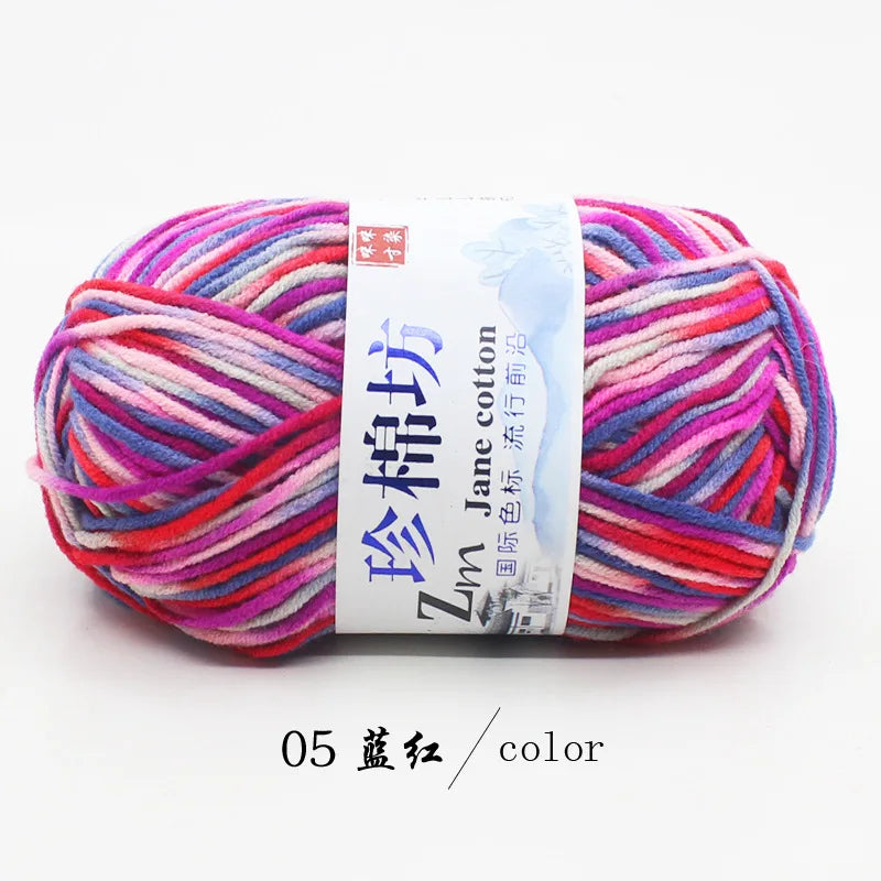 A ball of bright multi-colored yarn, featuring shades of pink, red, and blue, labeled as color 05, for knitting and crochet.