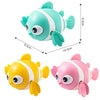 A set of wind-up swimming duck bath toys in teal and yellow colors for toddlers.