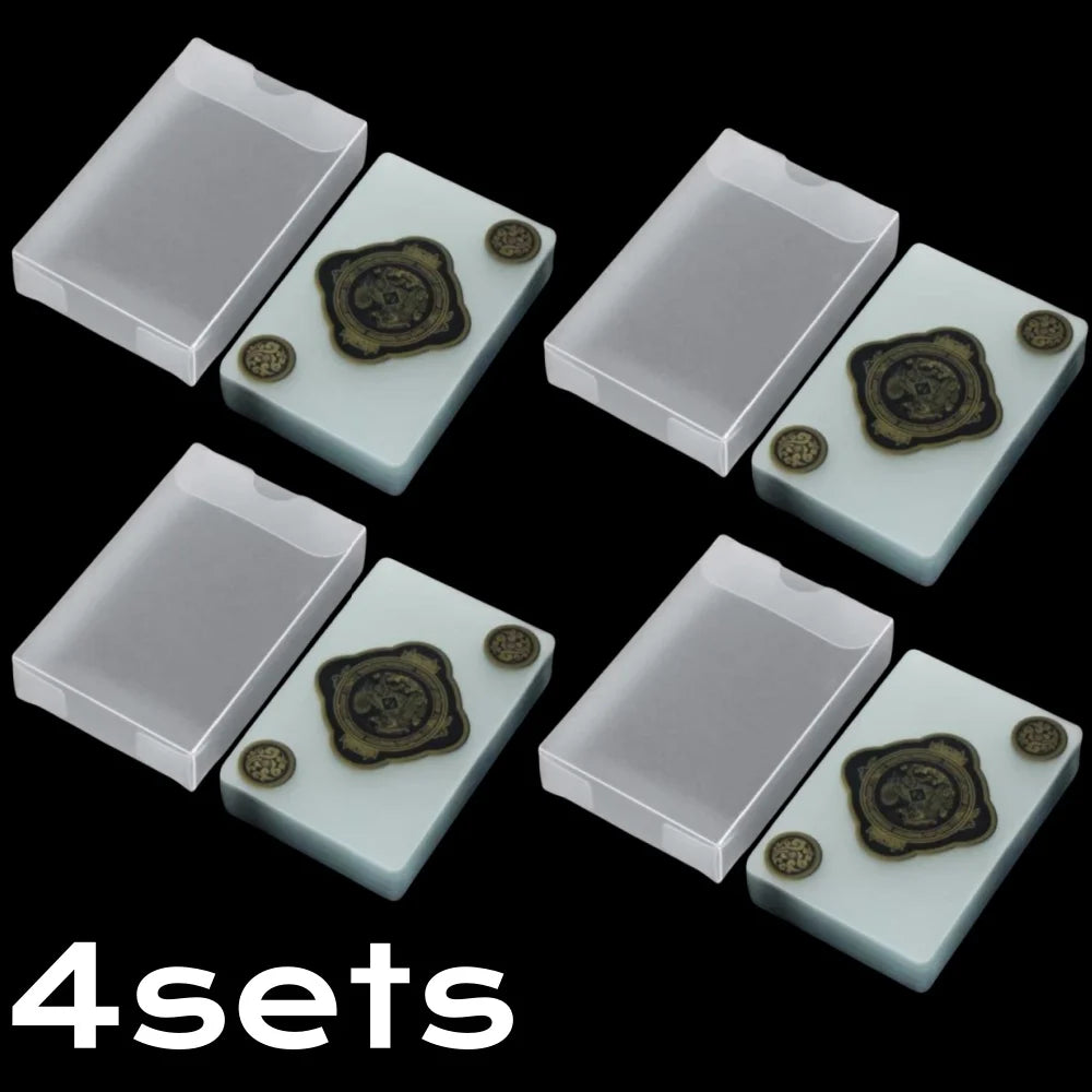 Four sets of waterproof transparent playing cards with decorative designs arranged in a grid pattern.