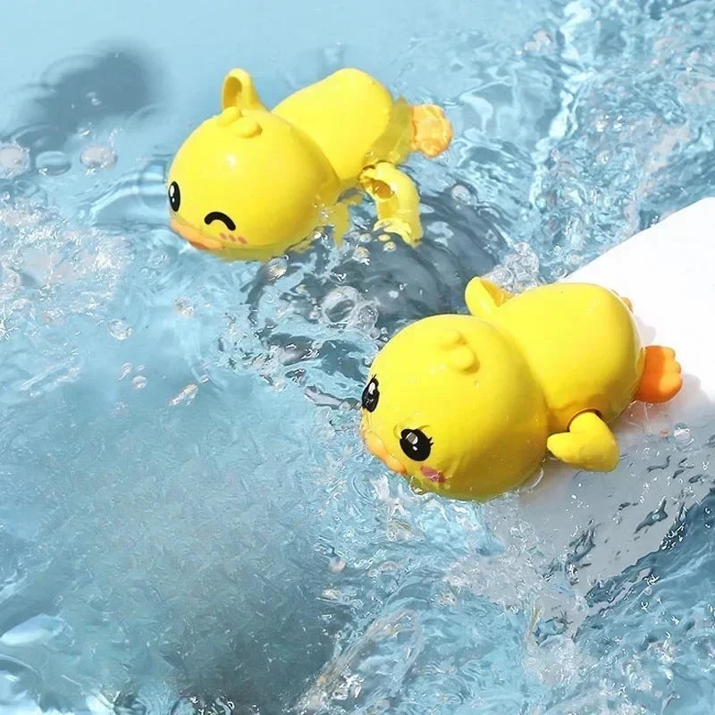 A yellow duck bath toy is visible in clear blue water.