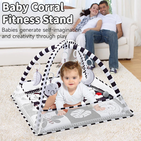 A baby corral fitness stand mat with various hanging toys and a playful design