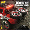 A red off-road tire is shown mounted on a high-speed 4WD brushless RC monster truck.