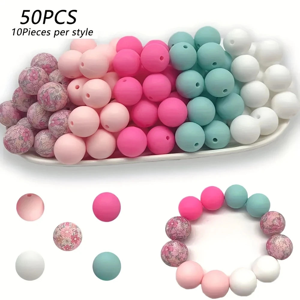 A collection of 50 silicone floral beads in various shades of pink, white, and teal for DIY jewelry making.