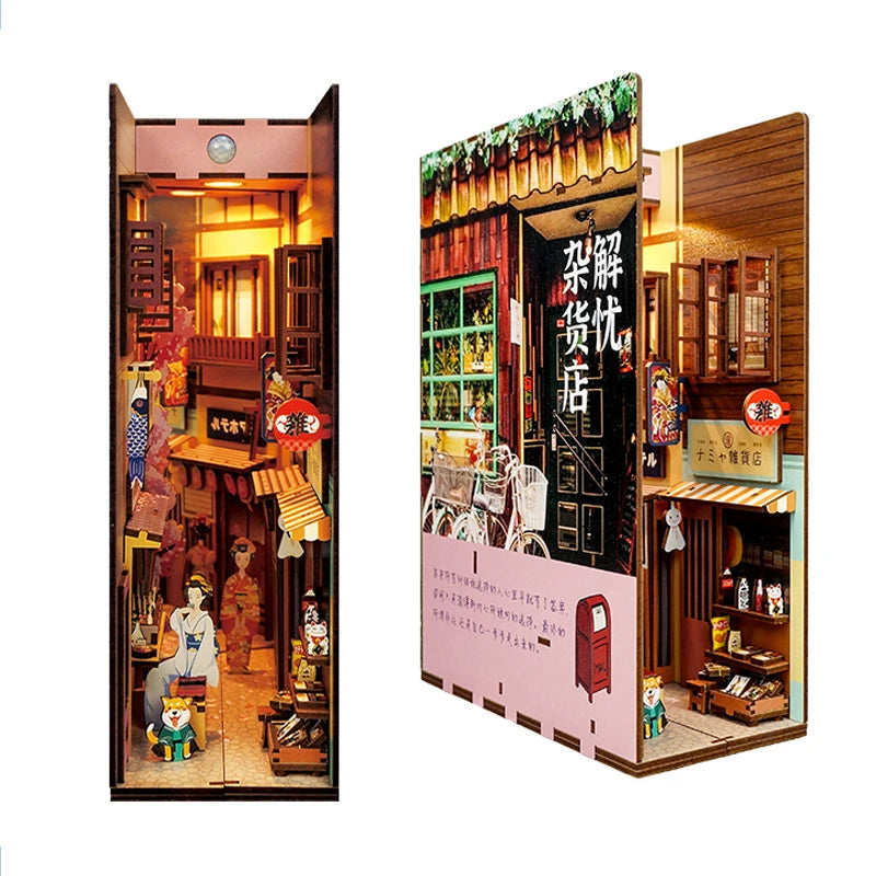 A DIY book nook kit featuring a detailed miniature Japanese-style shop with LED lighting and a dust cover.