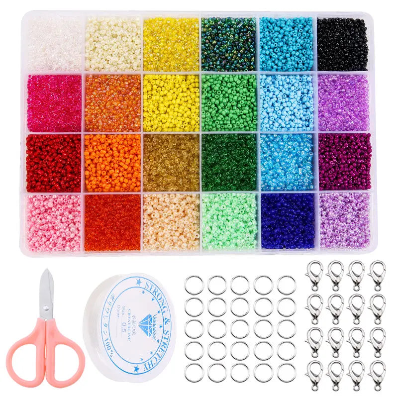 A storage tray filled with 24 colors of glass seed beads and a pair of pliers for jewelry making