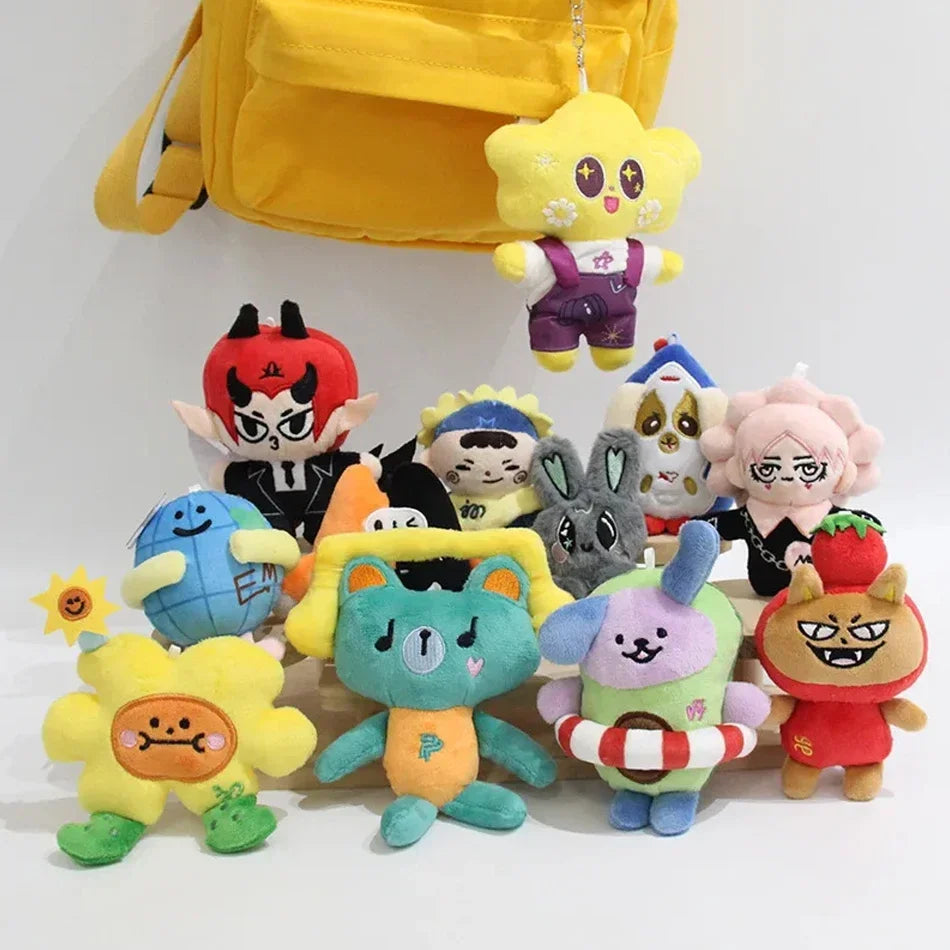 A collection of yellow and purple plush pendant dolls featuring characters from GMMTV celebrity couples.