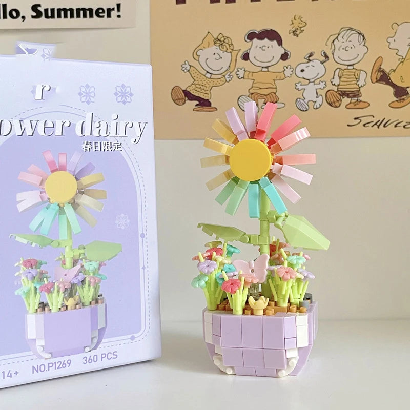 A miniature flower bouquet building block set featuring a large yellow and pink daisy flower.