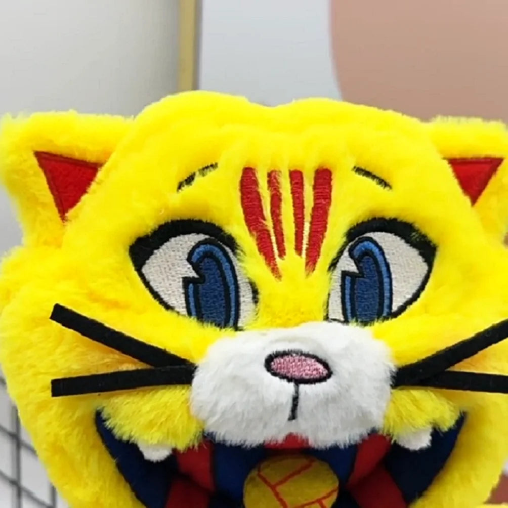 A bright yellow football mascot cat plush toy with black stripes and blue eyes.