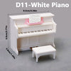 A white D11 piano model with a keyboard and a small white stool shown in a studio setting.