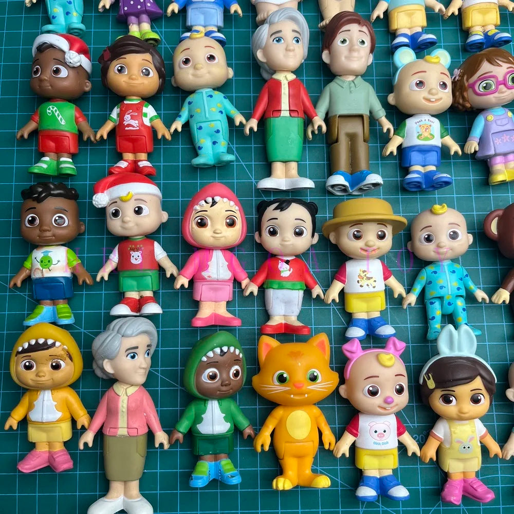 A collection of colorful cartoon PVC figurines featuring various characters and designs.