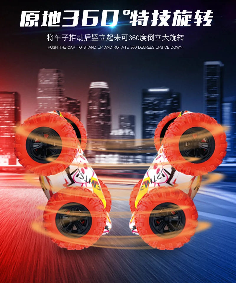 A close-up of a four-wheel drive stunt car with orange tires performing a 360-degree rotation in motion.