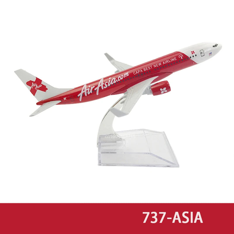 A diecast model of an AirAsia airplane in red and white livery.